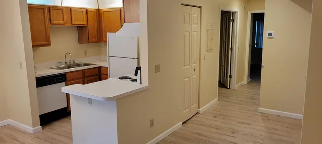 a kitchen with a sink and refrigerator