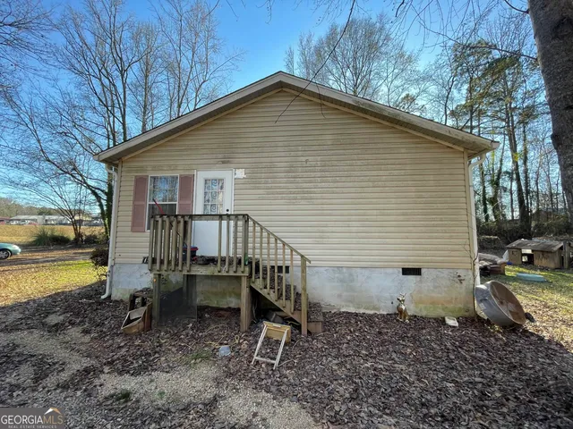 a view of a chairs and a table in the patio
