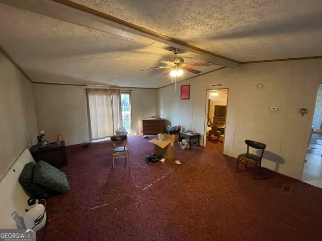 a view of house with a yard