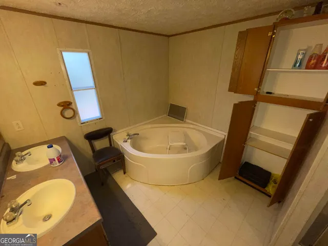 a bathroom with a toilet and a sink