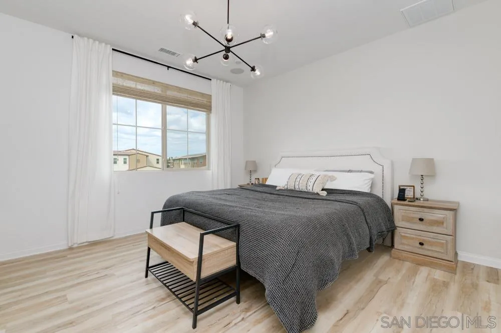 1643 Fig Tree Way Oceanside, CA 92056 - Photo 15 of 29 a bedroom with a bed and window