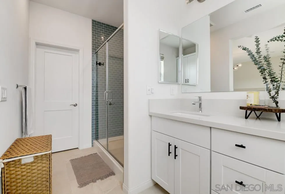 1643 Fig Tree Way Oceanside, CA 92056 - Photo 18 of 29 a bathroom with a sink and a mirror