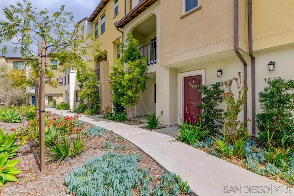 1643 Fig Tree Way Oceanside, CA 92056 - Photo 2 of 29 a front view of a house with a yard