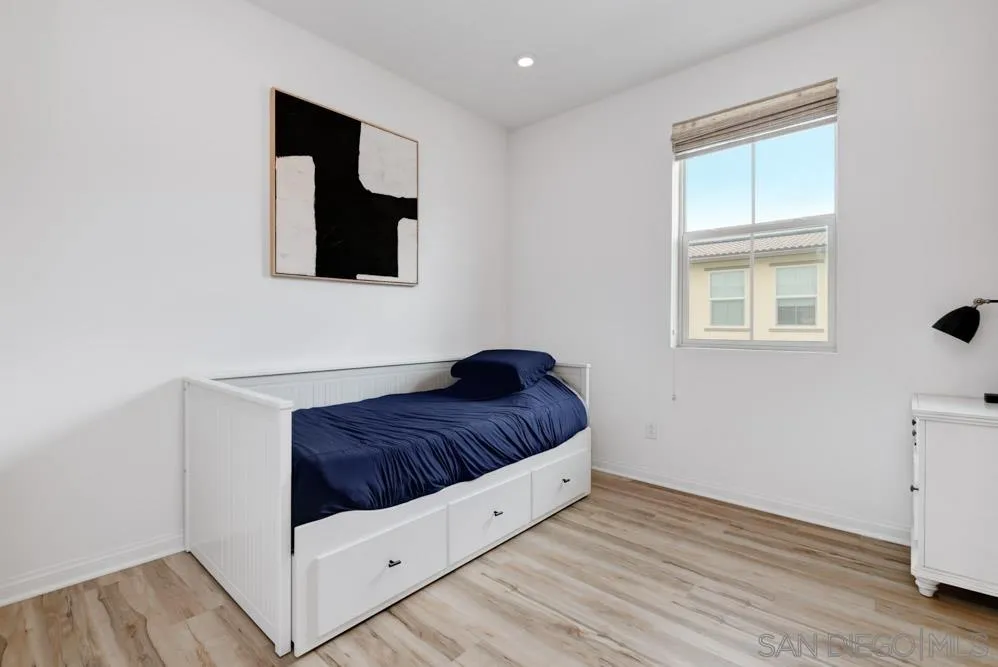 1643 Fig Tree Way Oceanside, CA 92056 - Photo 21 of 29 a living room with a bed and a window