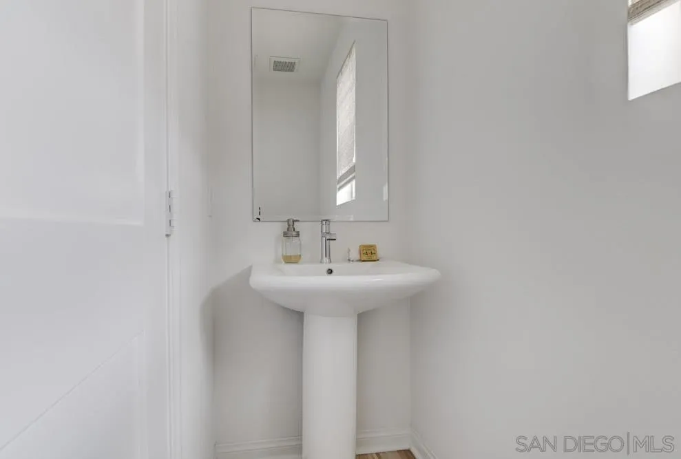 1643 Fig Tree Way Oceanside, CA 92056 - Photo 22 of 29 a bathroom with a sink and a mirror
