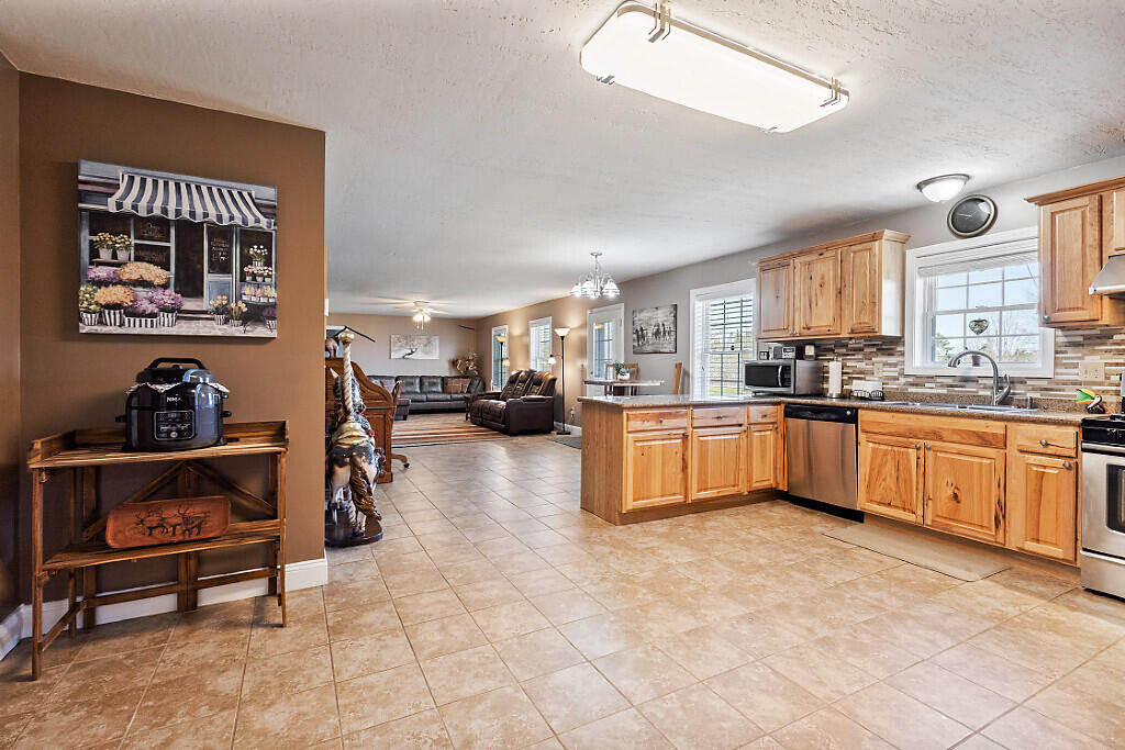 1391 Albion Road Winslow, ME 04901 - Photo 7 of 39 Kitchen towards living