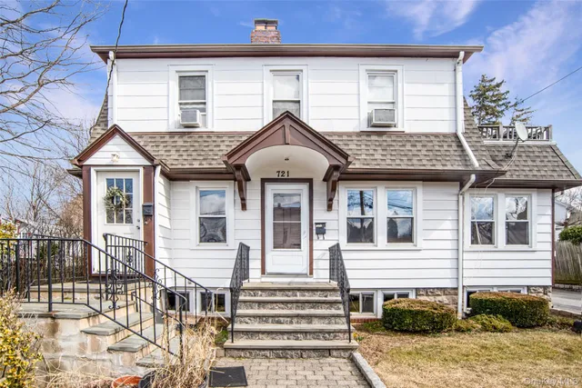 a front view of a house with a porch