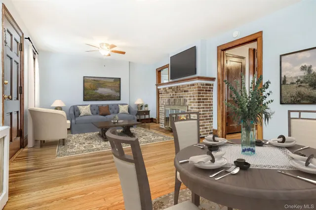 a living room with fireplace furniture and a flat screen tv