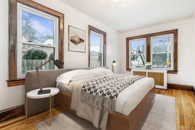 a bedroom with a large bed and a window