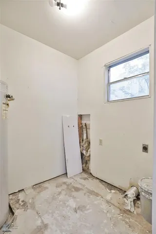 a view of a room with drop ceiling