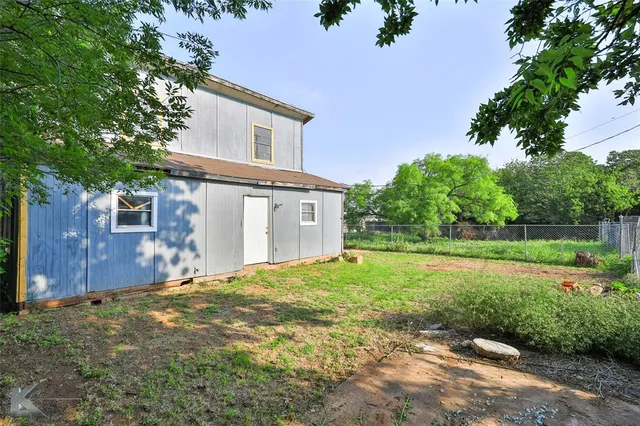 a house view with a garden space