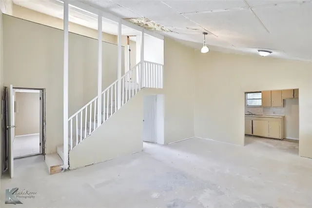 a view of an empty room with a window