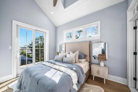 a bedroom with a large bed and a window