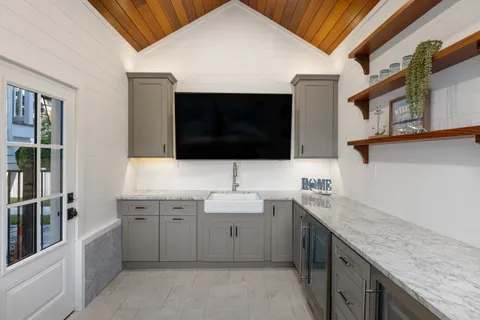 a spacious bathroom with a sink a large mirror and a bathtub