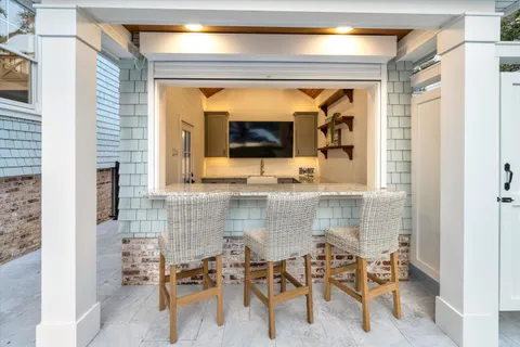 a bathroom with a toilet and a mirror