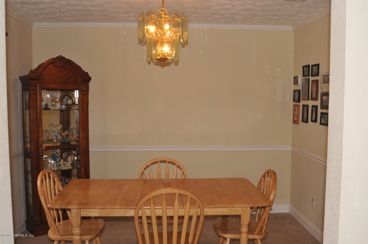 12945 Mandarin Road Jacksonville, FL 32223 - Photo 5 of 15 a view of a dining room with furniture