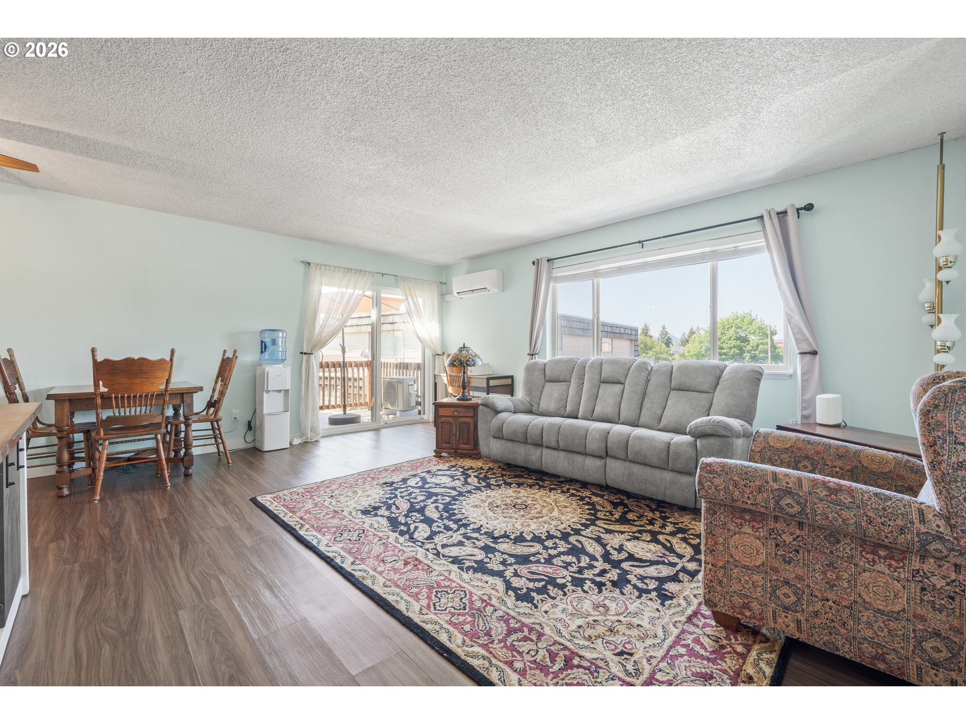 2727 Gateway Street, Unit 18 Springfield, OR 97477 - Photo 6 of 34 a living room with furniture and a wooden floor