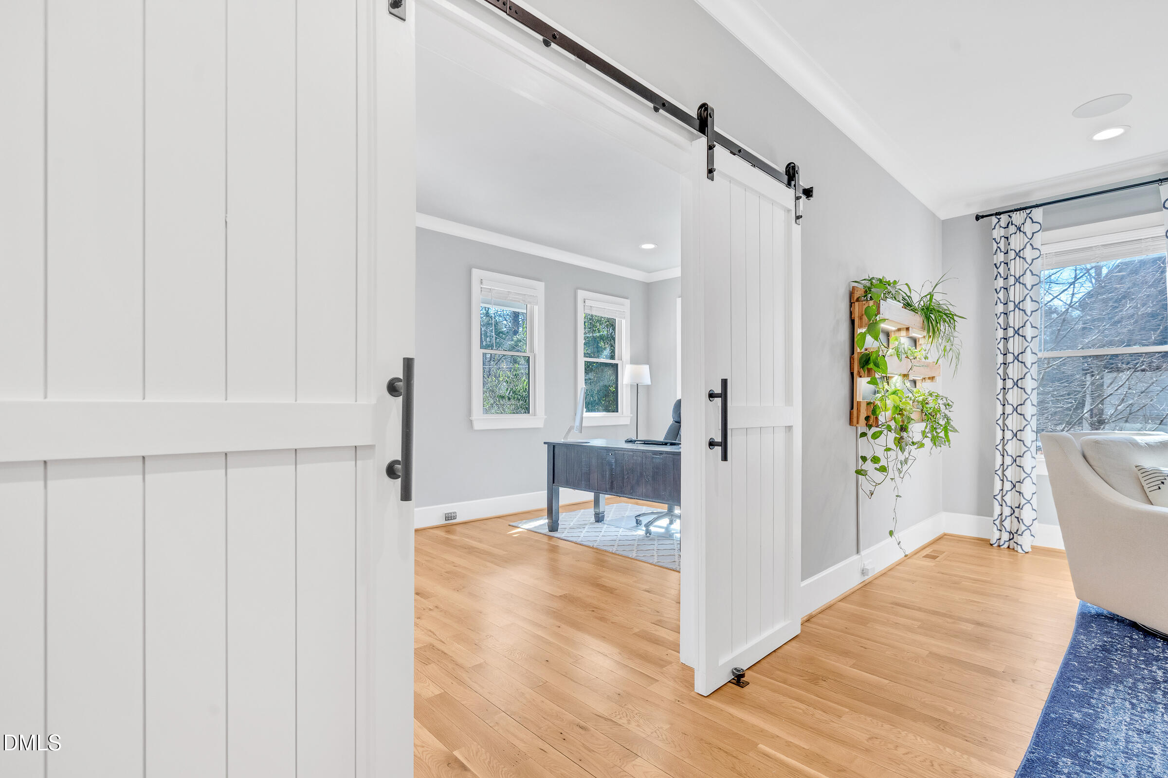 1433 Nottingham Road Raleigh, NC 27607 - Photo 11 of 55 a view of a hallway with wooden floor and furniture