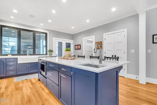 a kitchen with stainless steel appliances granite countertop a stove and a large cabinets