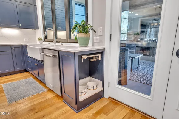 a kitchen with a sink and a refrigerator