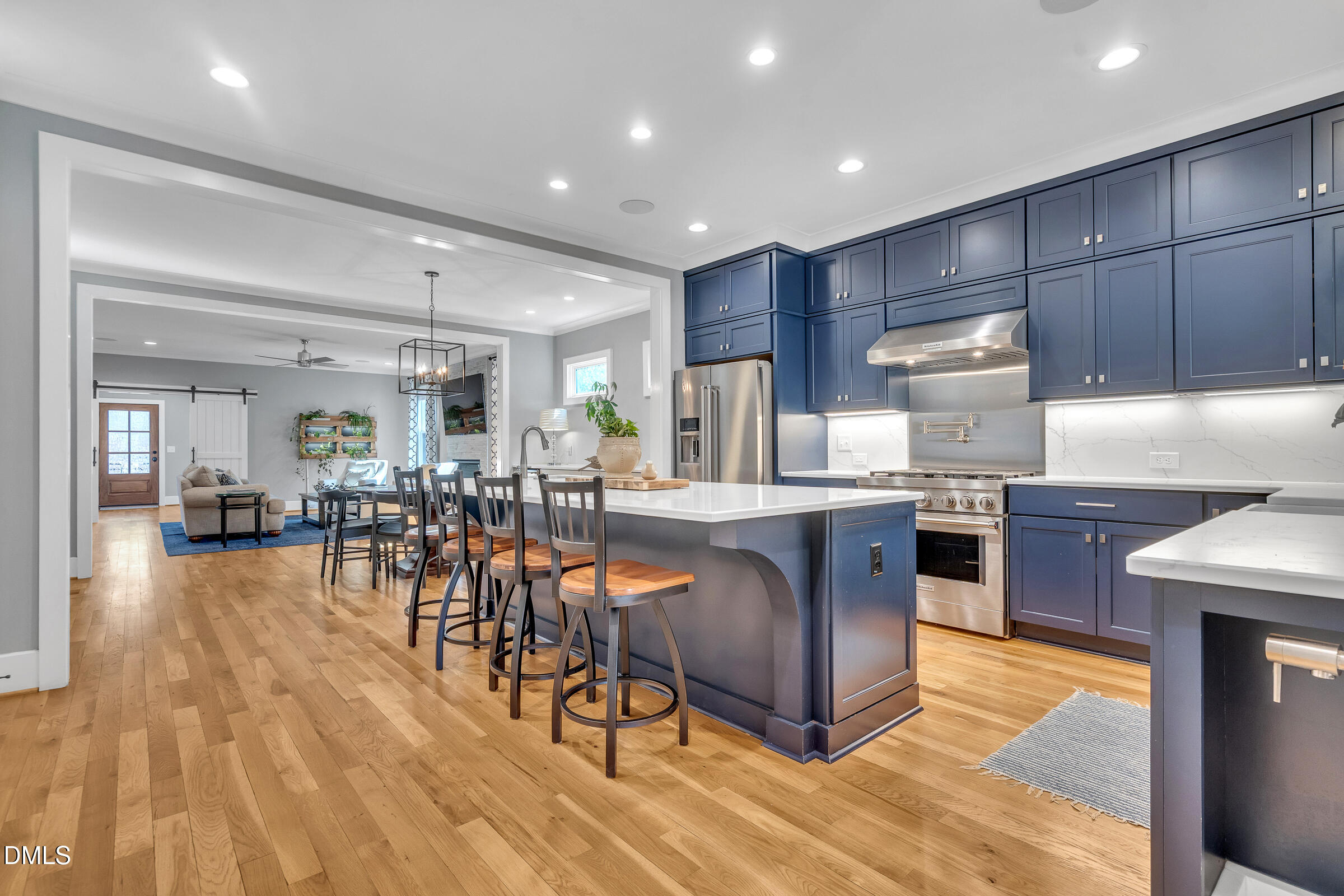 1433 Nottingham Road Raleigh, NC 27607 - Photo 21 of 55 a kitchen with stainless steel appliances granite countertop a table chairs refrigerator and a sink