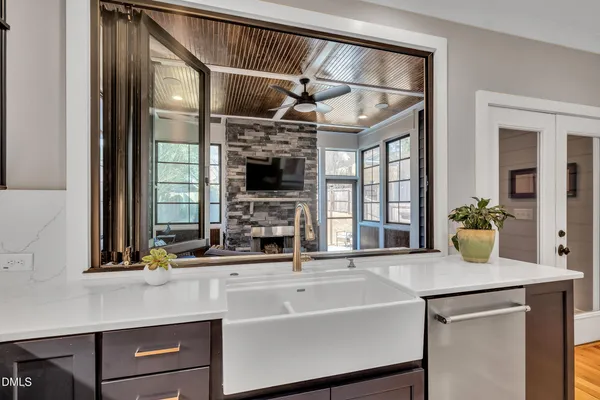 a bathroom with a granite countertop sink a toilet and a mirror