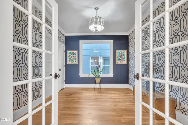 a bathroom with a granite countertop sink a mirror and shower
