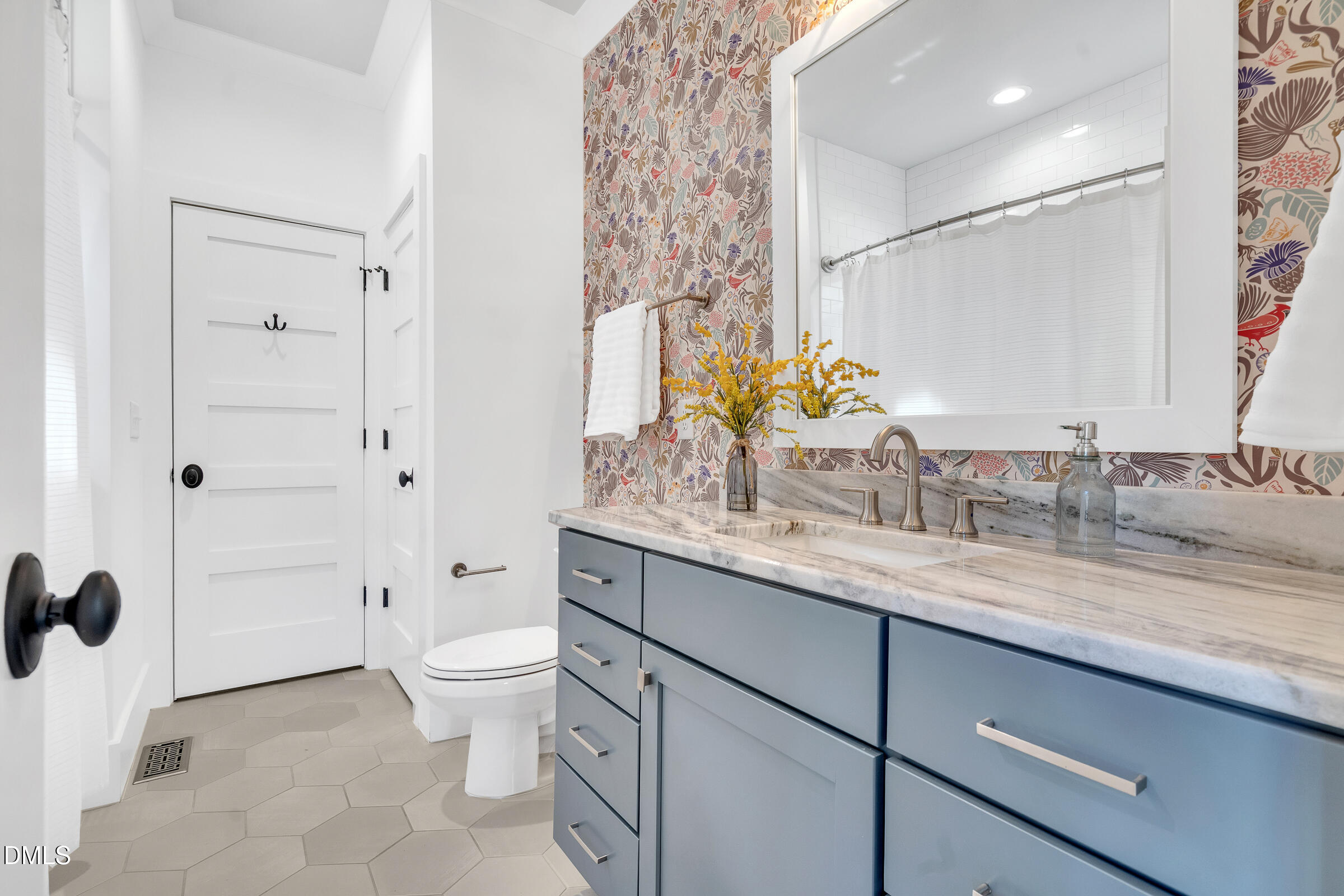 1433 Nottingham Road Raleigh, NC 27607 - Photo 26 of 55 a bathroom with a granite countertop sink a toilet and a mirror