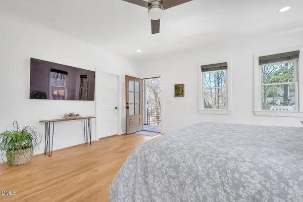 a white bath tub sitting next to a window