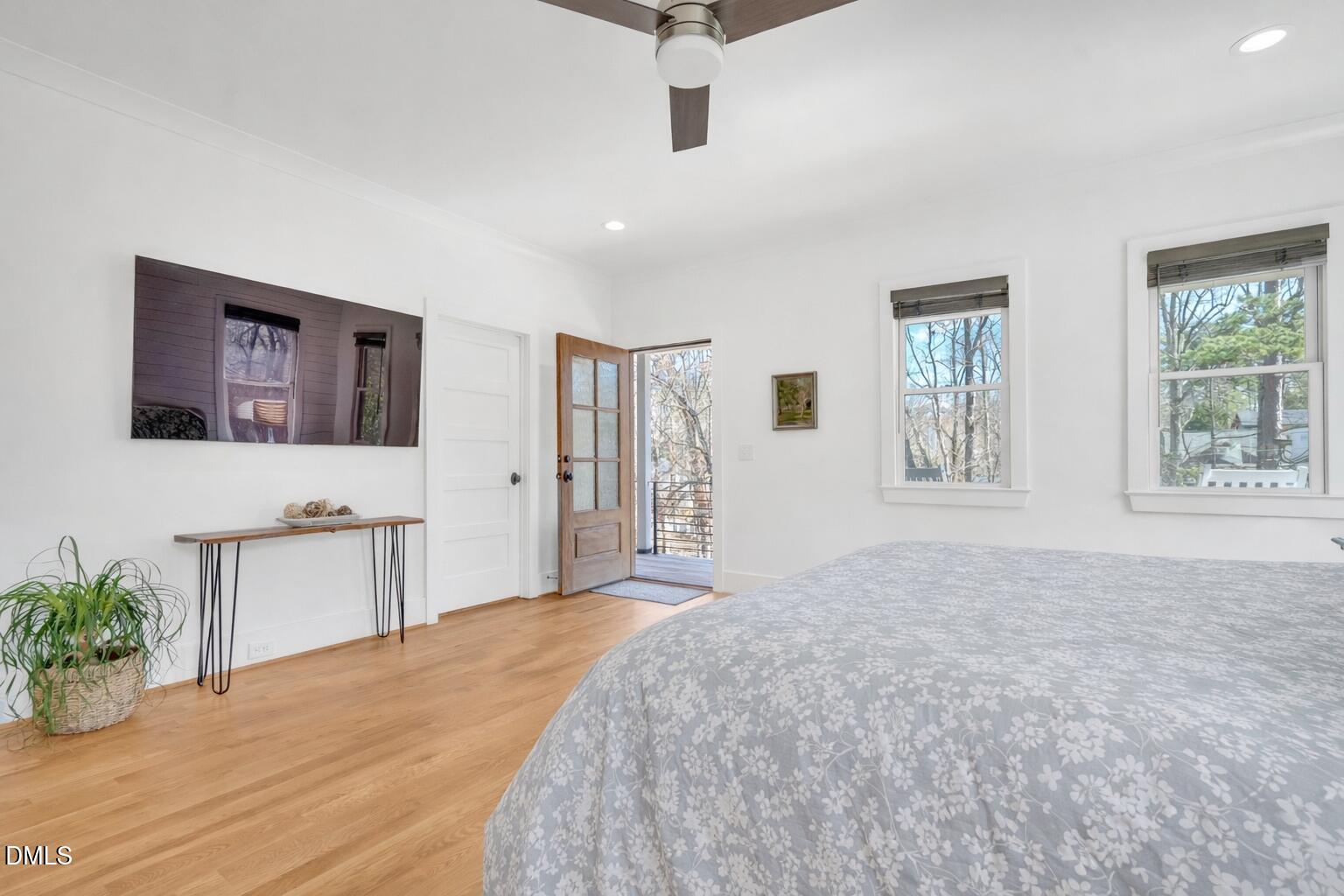 1433 Nottingham Road Raleigh, NC 27607 - Photo 31 of 55 a spacious bedroom with a bed and a window