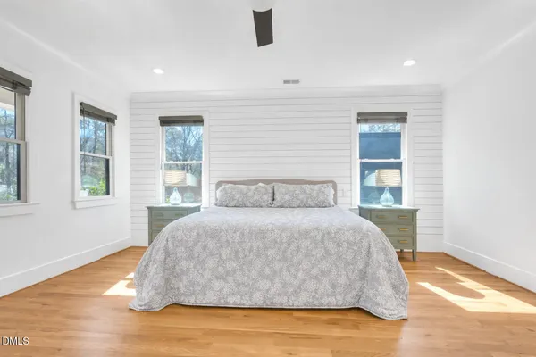 a bathroom with a granite countertop double vanity sink and a mirror
