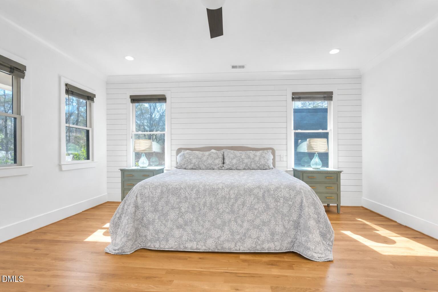 1433 Nottingham Road Raleigh, NC 27607 - Photo 32 of 55 a large bed sitting in a bedroom next to a window