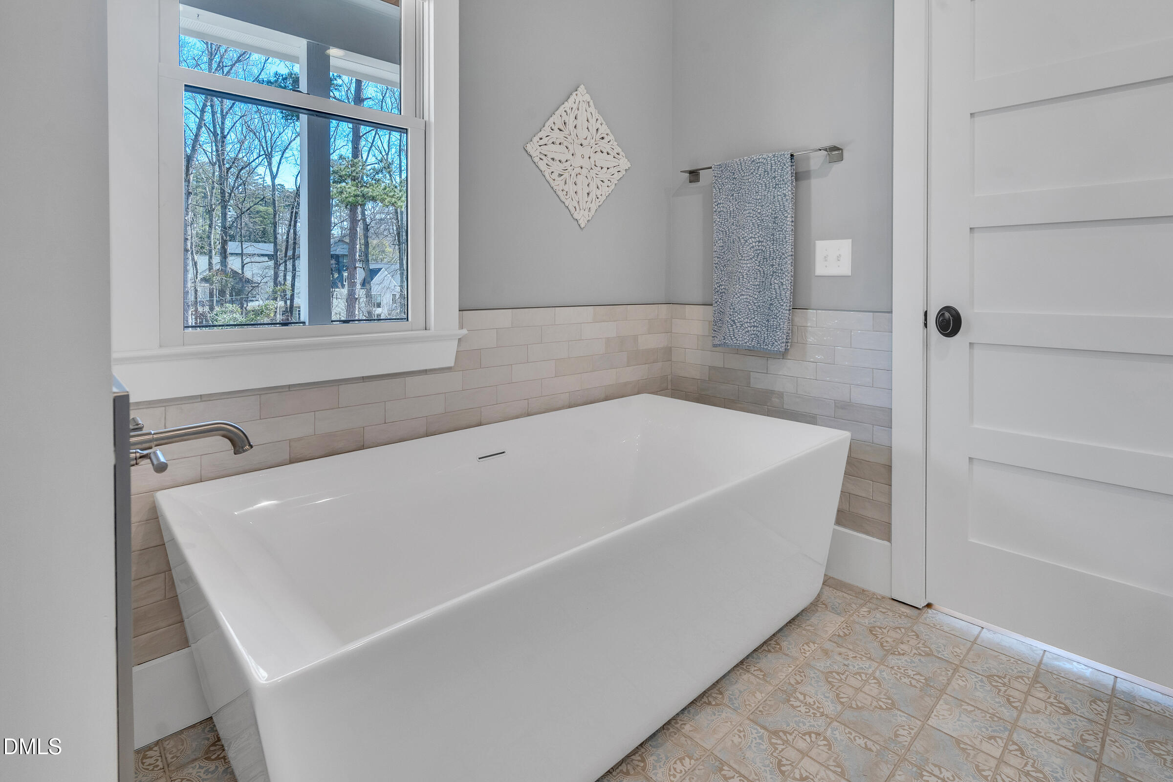 1433 Nottingham Road Raleigh, NC 27607 - Photo 35 of 55 a white bath tub sitting next to a window