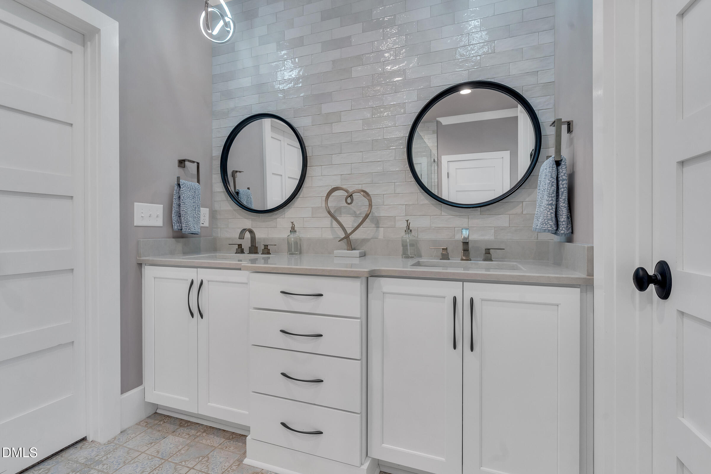 1433 Nottingham Road Raleigh, NC 27607 - Photo 36 of 55 a bathroom with a granite countertop double vanity sink and a mirror