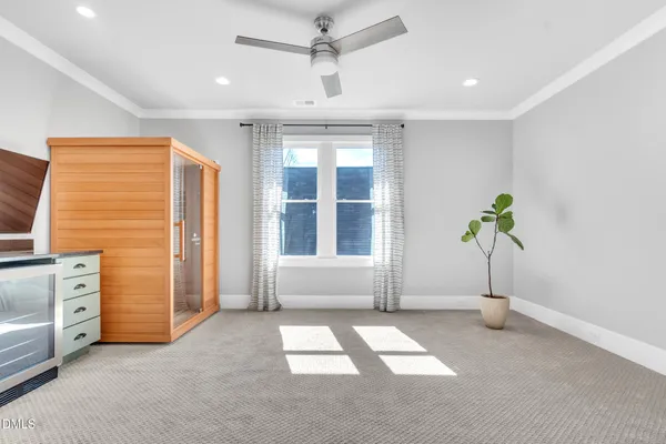 a bedroom with a bed window and table