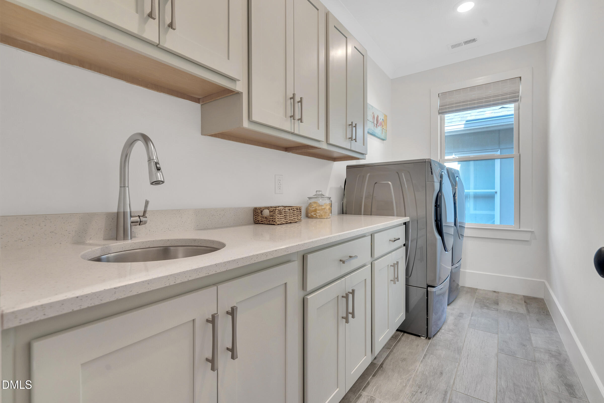 1433 Nottingham Road Raleigh, NC 27607 - Photo 41 of 55 a kitchen with cabinets and a sink