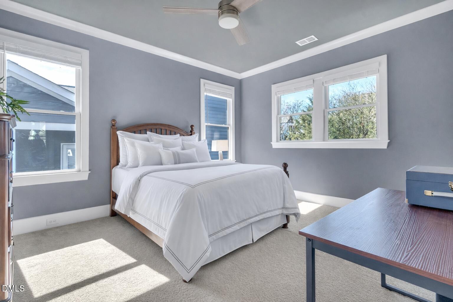 1433 Nottingham Road Raleigh, NC 27607 - Photo 42 of 55 a bedroom with a bed window and table