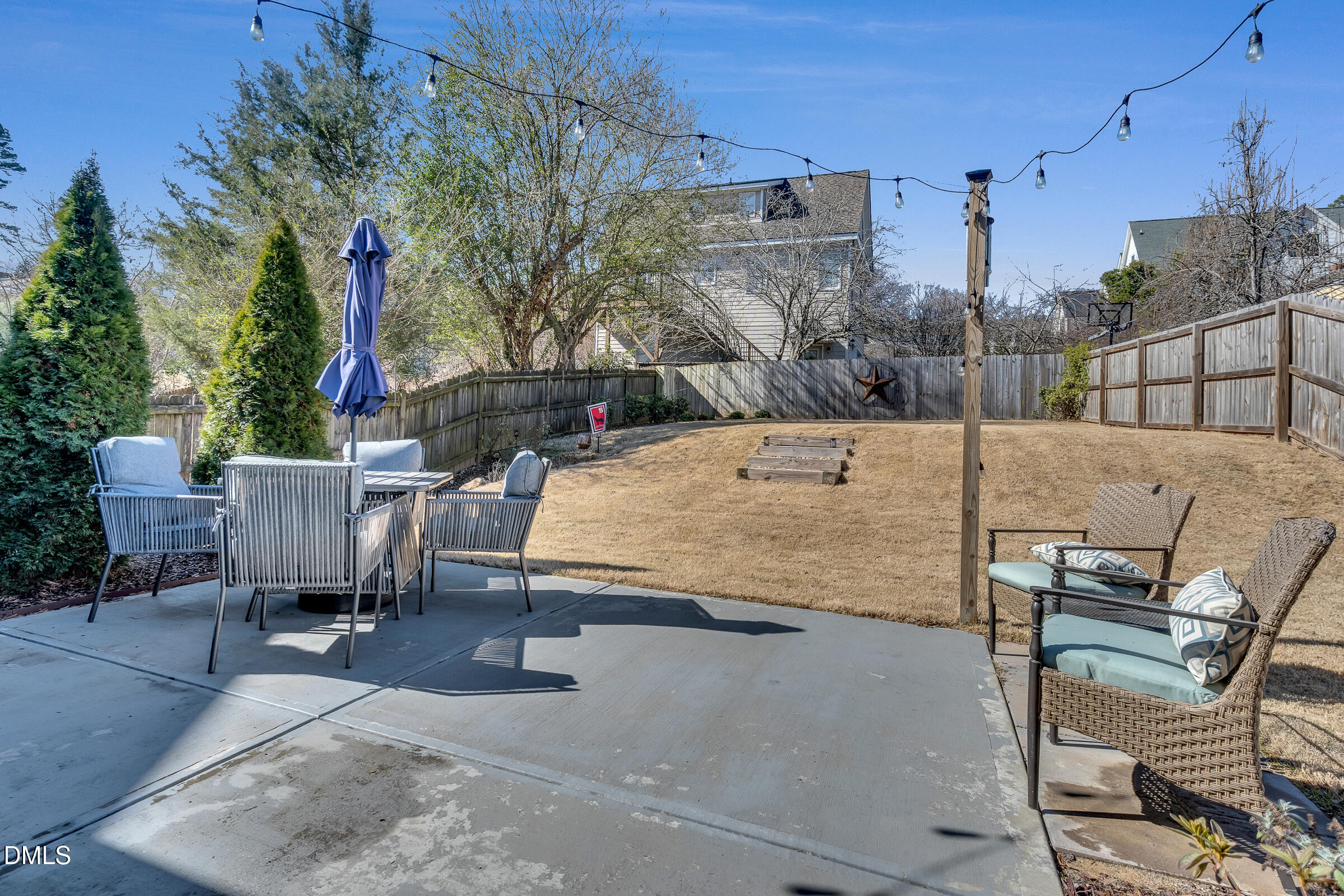 1433 Nottingham Road Raleigh, NC 27607 - Photo 51 of 55 a view of a patio with a table and chairs