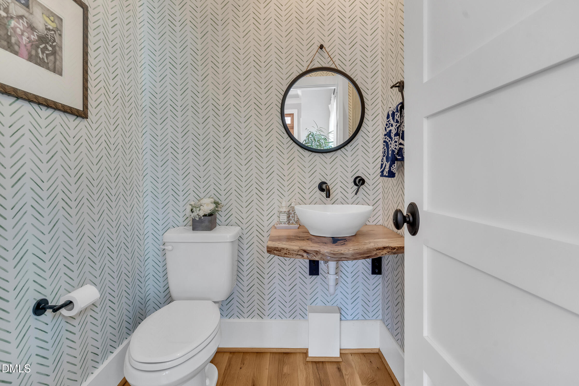 1433 Nottingham Road Raleigh, NC 27607 - Photo 8 of 55 a bathroom with a toilet a sink and a mirror