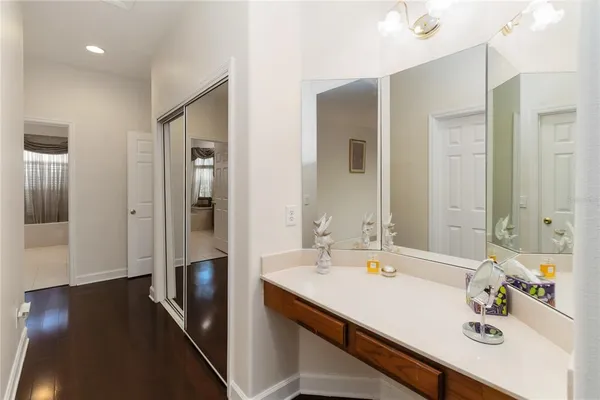 a bathroom with a sink double vanity and a mirror