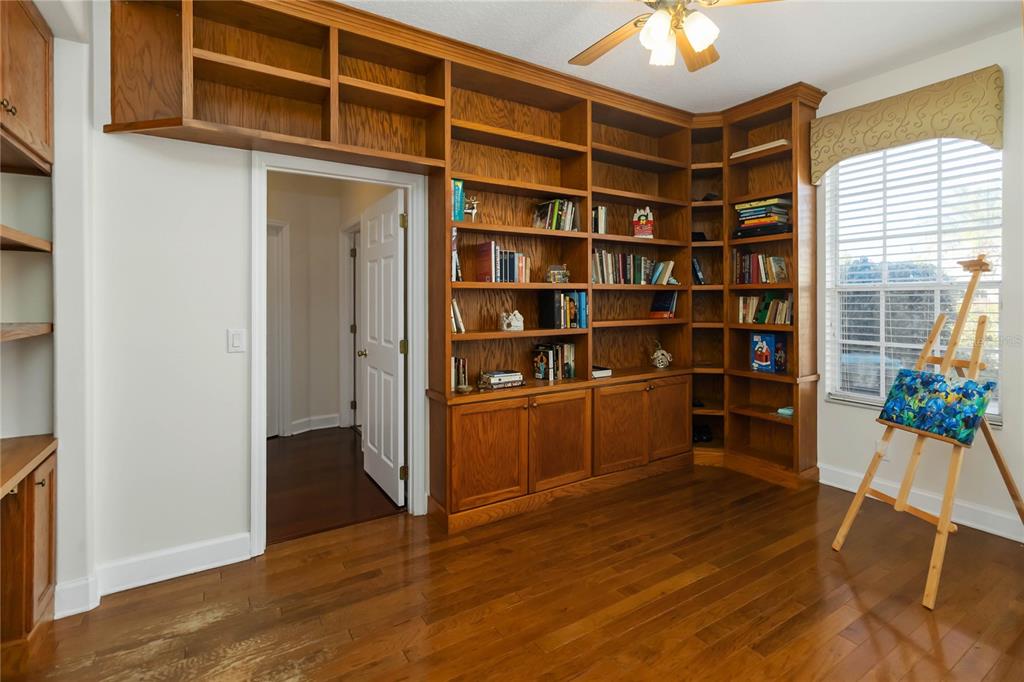 9138 Shadowbrook Trail Orlando, FL 32825 - Photo 18 of 47 a view of a workspace with furniture and wooden floor