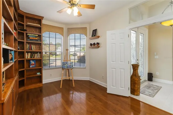 a view of room with window and wooden floor