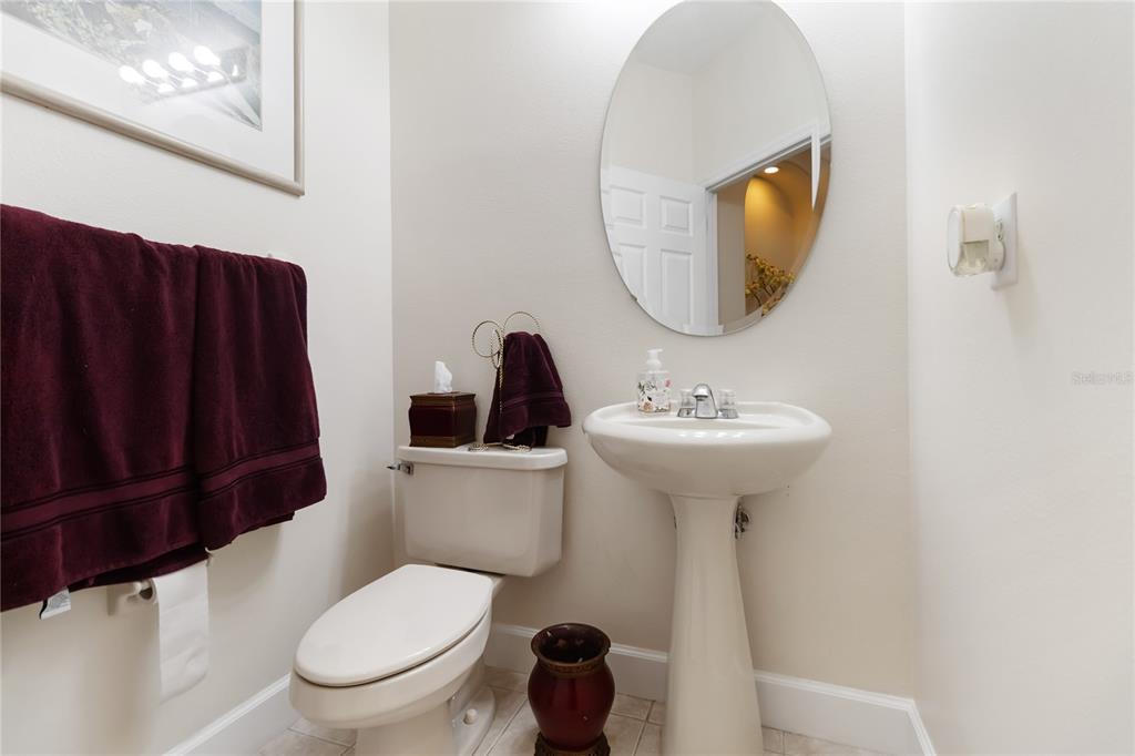 9138 Shadowbrook Trail Orlando, FL 32825 - Photo 20 of 47 a bathroom with a sink a mirror a toilet and a mirror