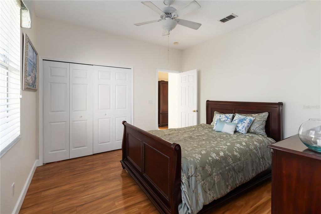 9138 Shadowbrook Trail Orlando, FL 32825 - Photo 26 of 47 a bedroom with a bed and a chandelier
