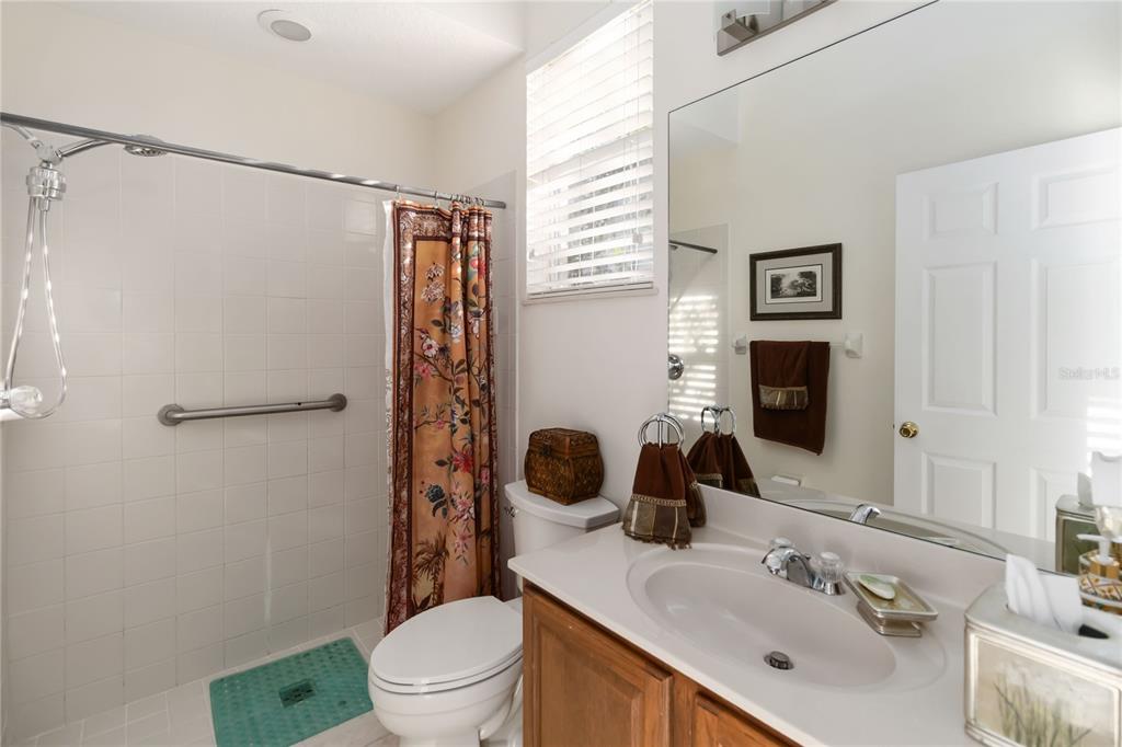 9138 Shadowbrook Trail Orlando, FL 32825 - Photo 27 of 47 a bathroom with a sink toilet and shower