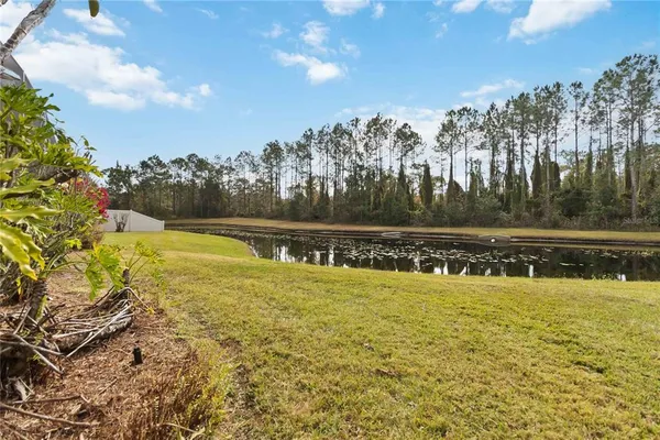 a view of a swimming pool with an outdoor space and seating area