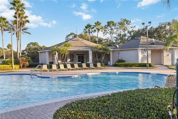 a view of a house with swimming pool yard and patio