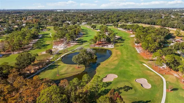 an aerial view of a residential houses with outdoor space