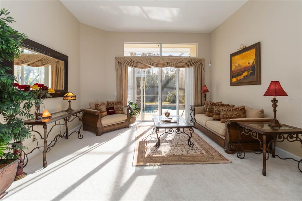 9138 Shadowbrook Trail Orlando, FL 32825 - Photo 6 of 47 a living room with furniture and a large window