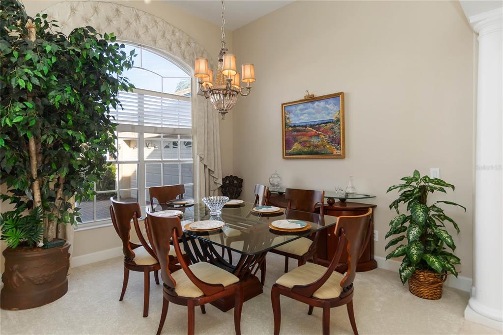 9138 Shadowbrook Trail Orlando, FL 32825 - Photo 7 of 47 a view of a dining room with furniture and chandelier